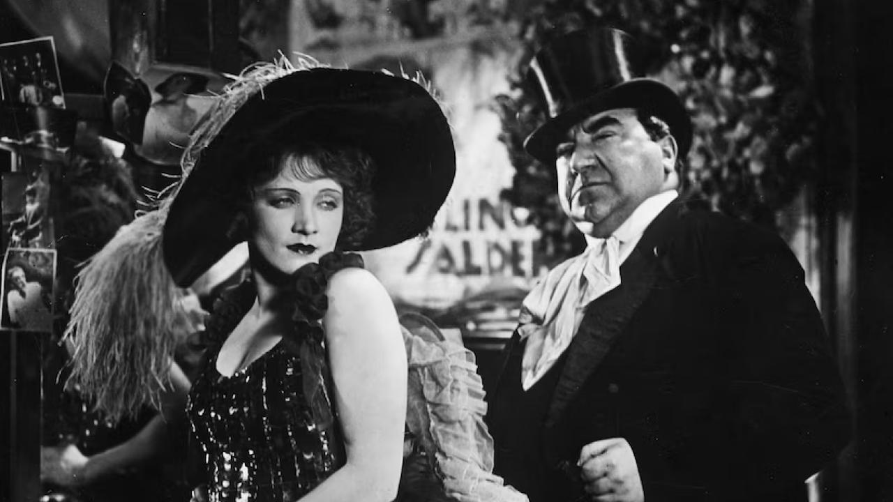 A black and white photo of old film stars 