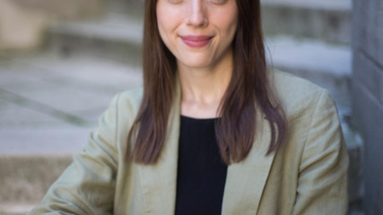 A woman smiling at the camera